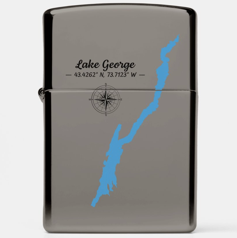A glossy black lighter featuring a custom graphic of Lake George with its coordinates and a compass rose, shown on a light gray background.