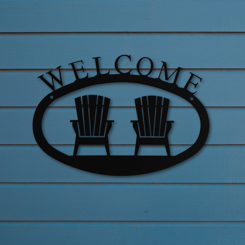 Metal 'Welcome' sign with two Adirondack chairs against a blue wooden background