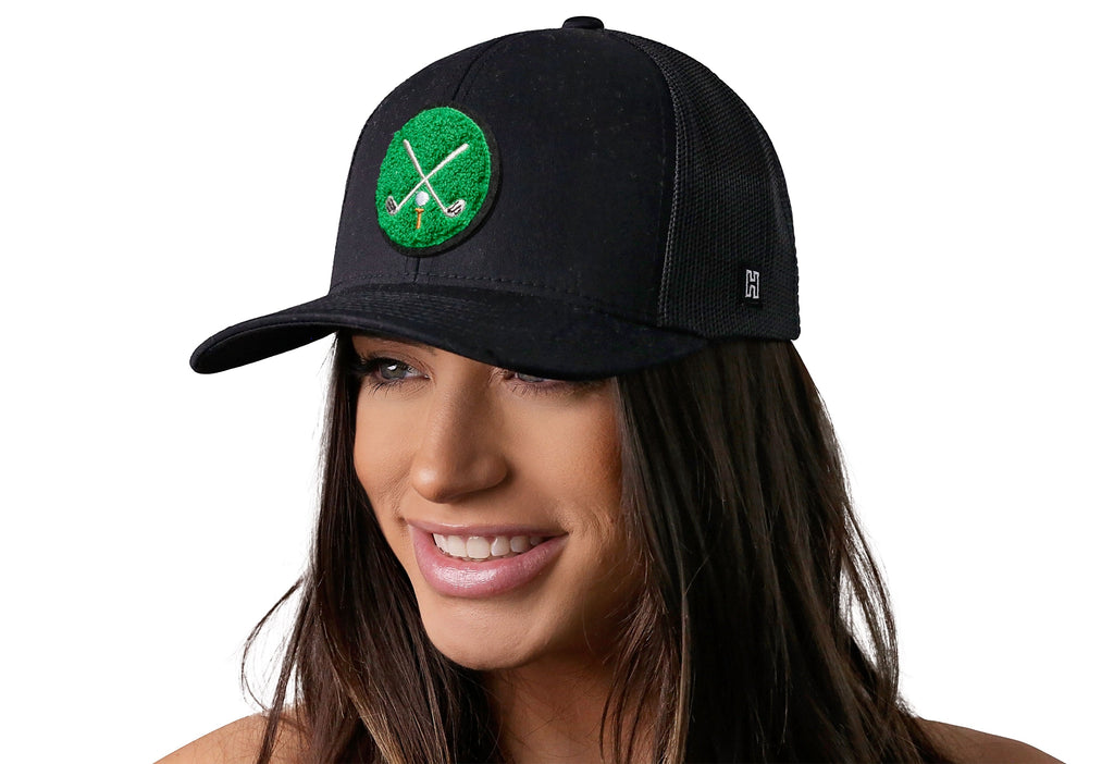Haka Golf Trucker Hat with Club X chenille patch with female model