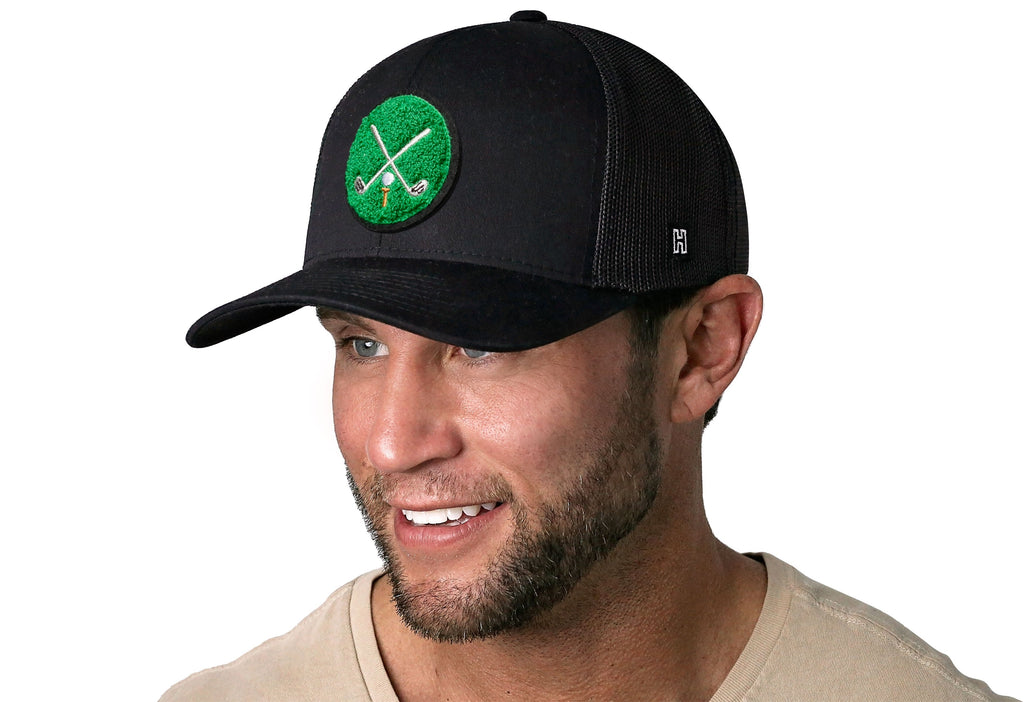 Haka Golf Trucker Hat with Club X chenille patch with male model