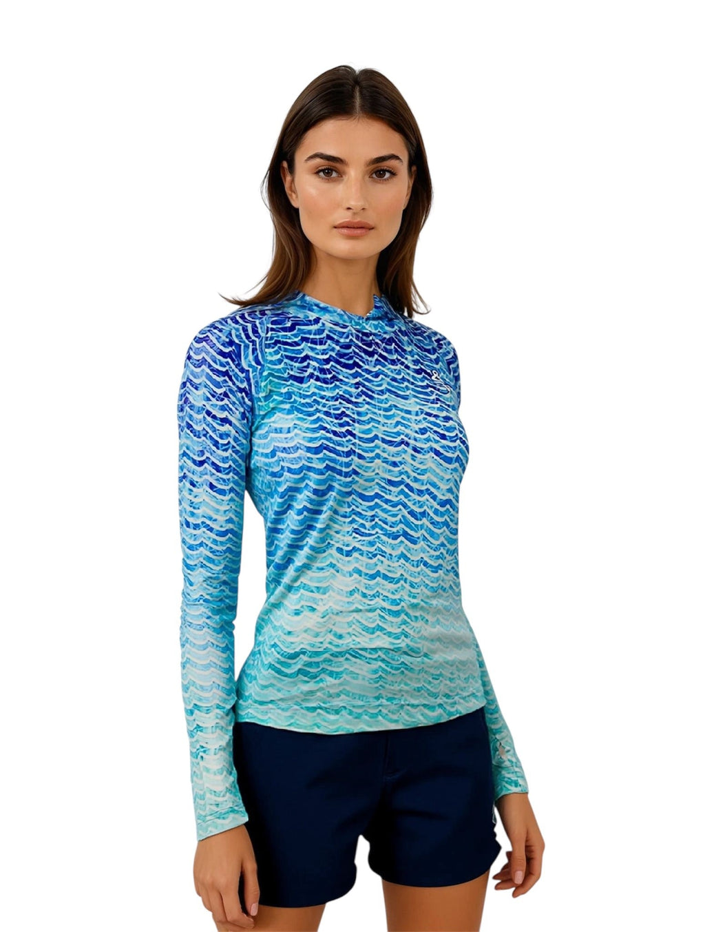 Woman wearing a blue and green patterned long-sleeve shirt on a white background