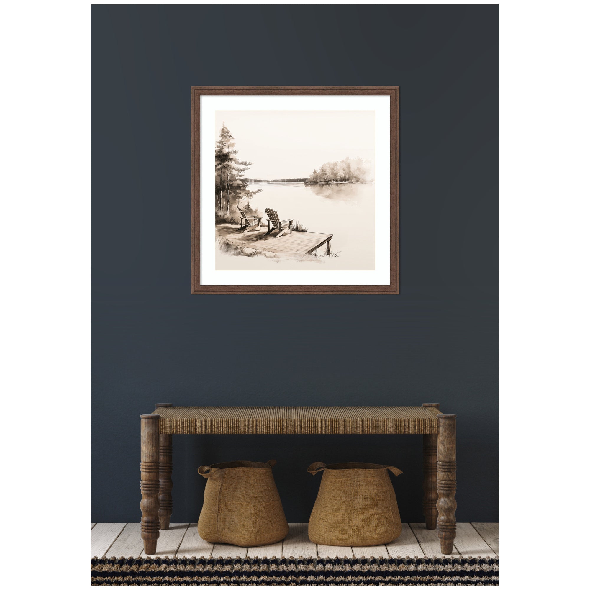 Framed artwork on a dark wall above a wooden console table with two storage totes.