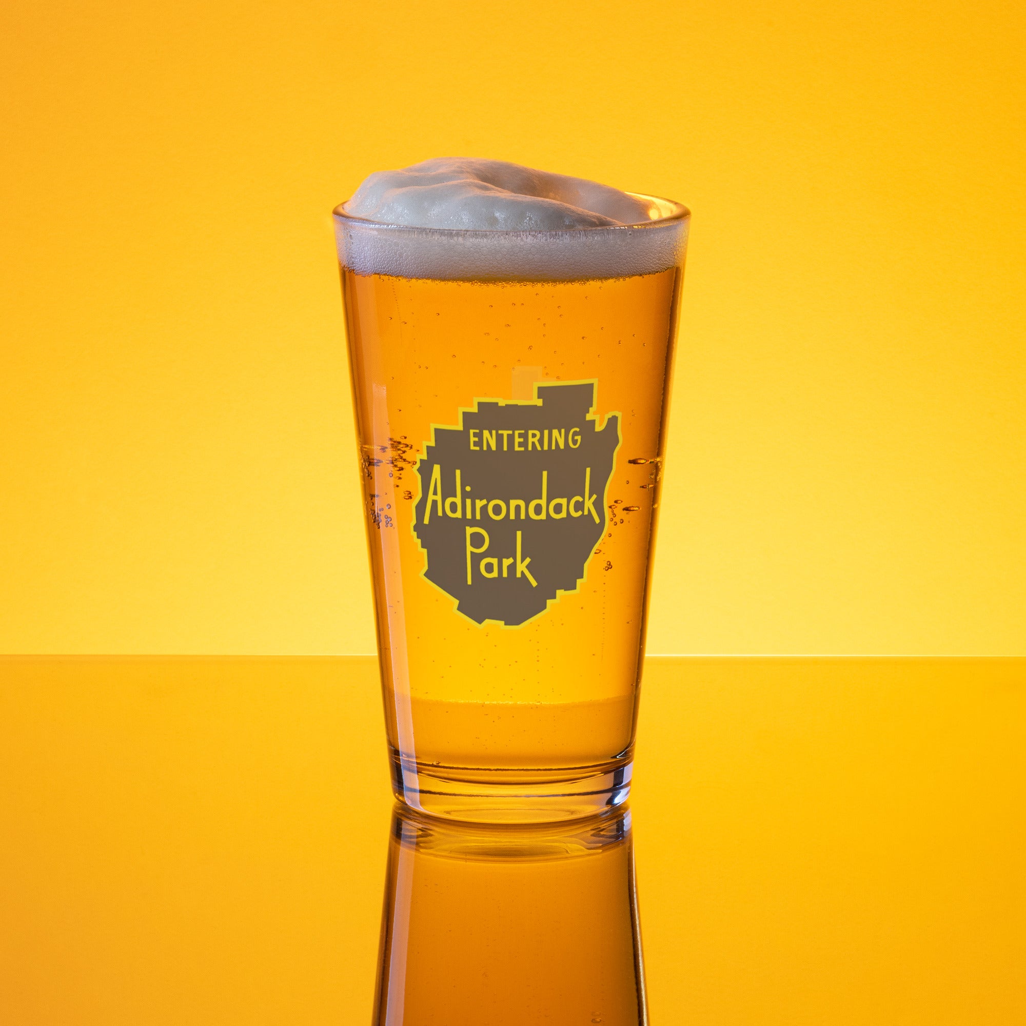 Entering Adirondack Park vintage sign design pint glass gold background