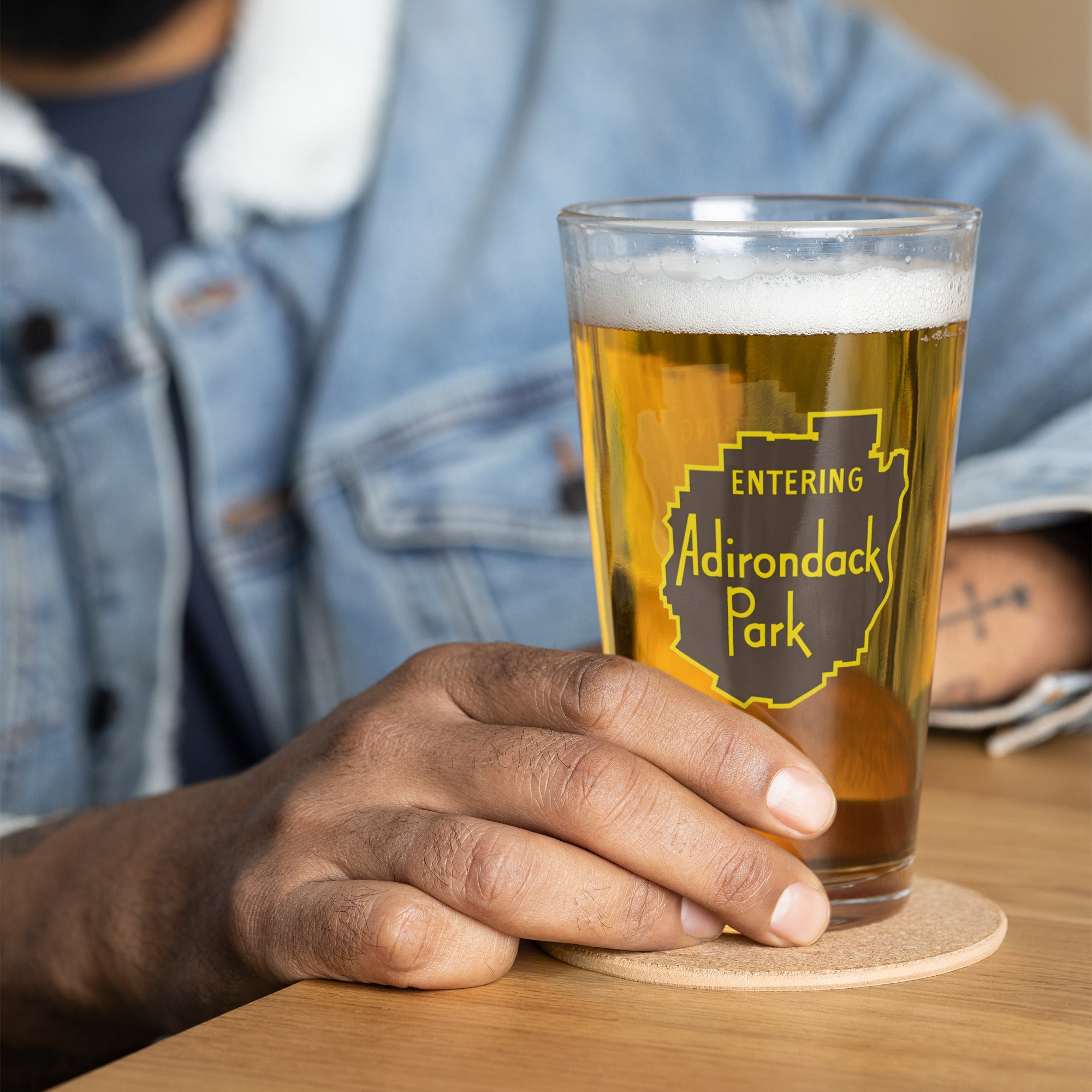 Entering Adirondack Park vintage sign design pint glass in situ at bar