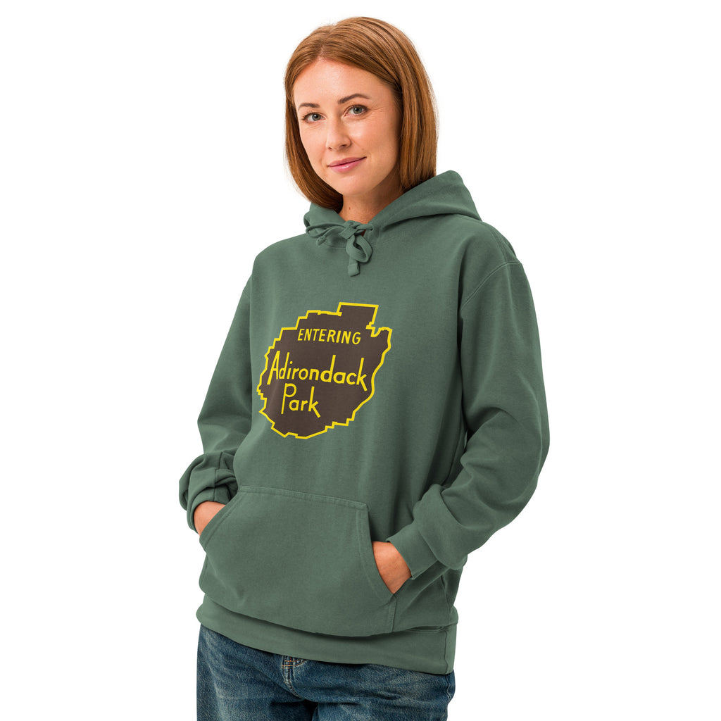Entering Adirondack Park Vintage Sign Hoodie Front View with Model Green